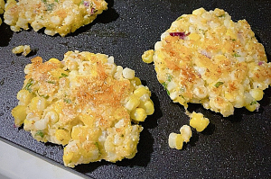southern corn fritters on a skillet using fresh corn on the cob